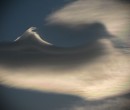 A wave begins to form above the cloud