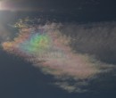 Cirrus clouds that are iridescent or nacreous