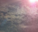 Cirrus clouds that are iridescent or nacreous