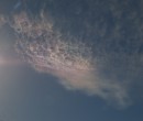 Cirrus clouds that are iridescent or nacreous