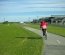 Riding alongside Woonona Beach and Beach Road